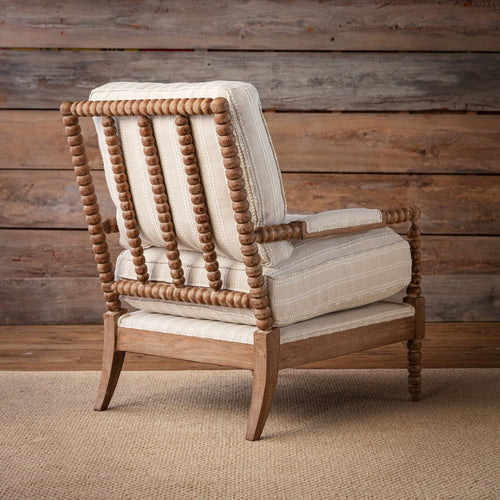 Poltrona di design - La nostra è una versione aggiornata della classica poltrona a girandola, caratterizzata da un tessuto colorato e strutturato che contrasta splendidamente con una finitura in legno più chiaro, t